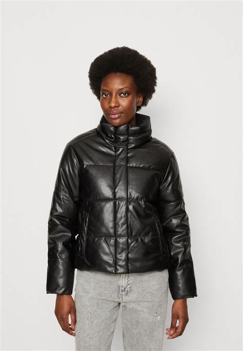 Stay warm and stylish with our trendy selection of sleeveless puffer jackets for men and women. . Gap black puffer jacket